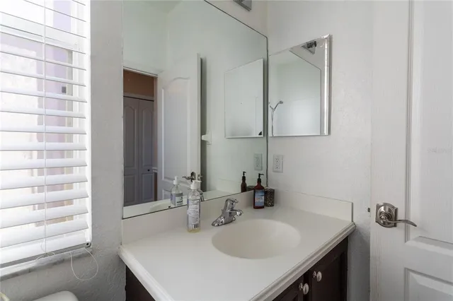 a bathroom with a sink and a mirror