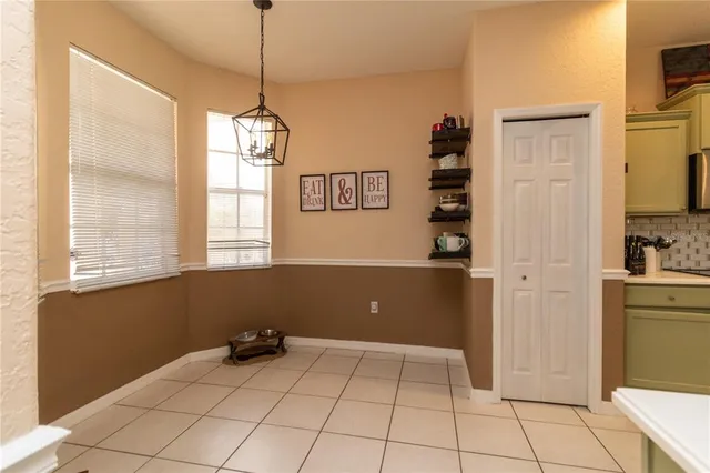 a view of a kitchen with a sink and dishwasher cabinets