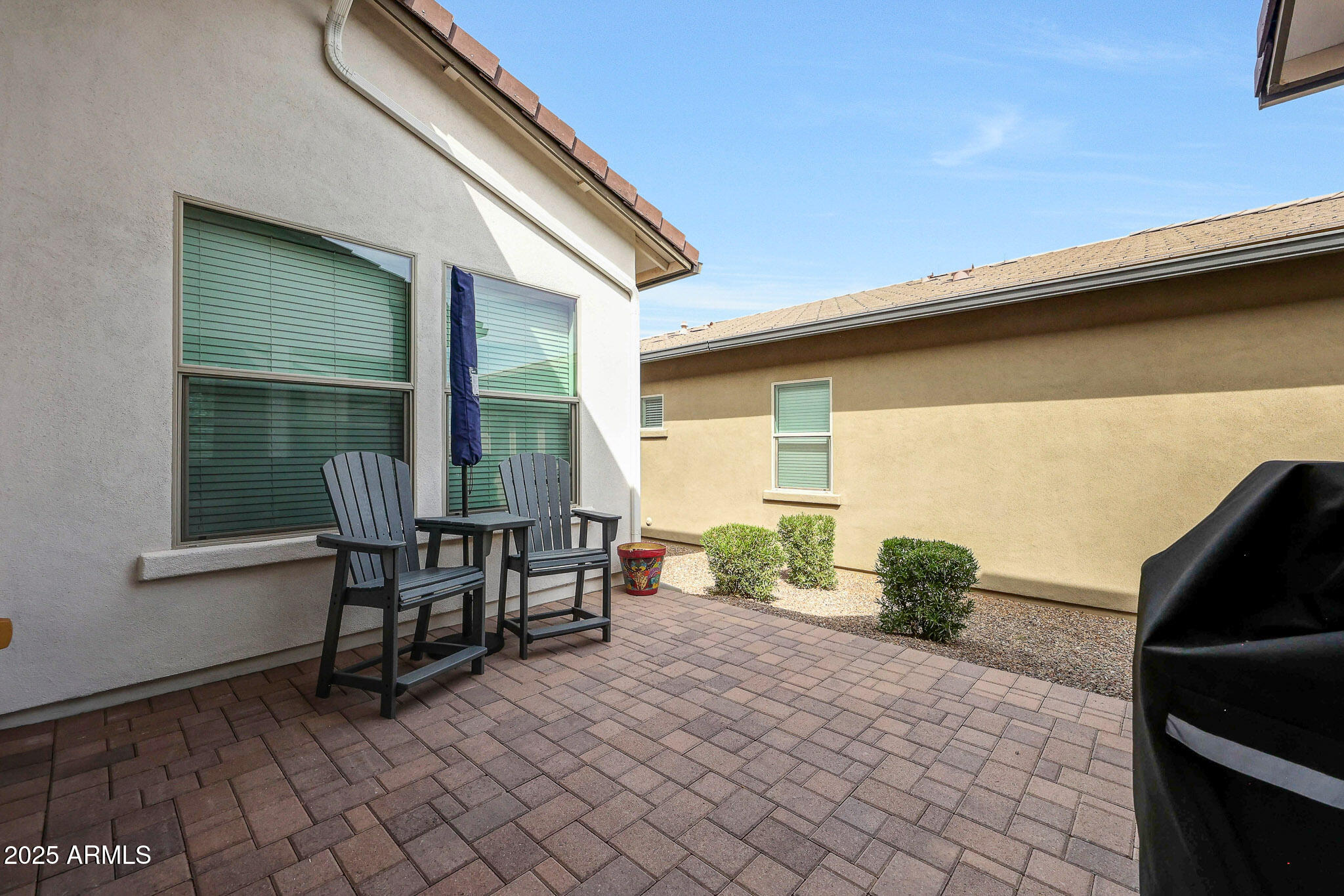 20771 West Colter Street Buckeye, AZ 85396 - Photo 12 of 44 a view of a two chairs in a patio