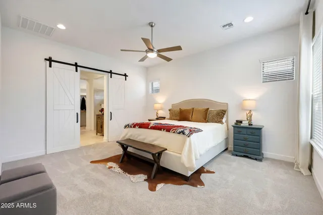 a view of a hallway view with staircase