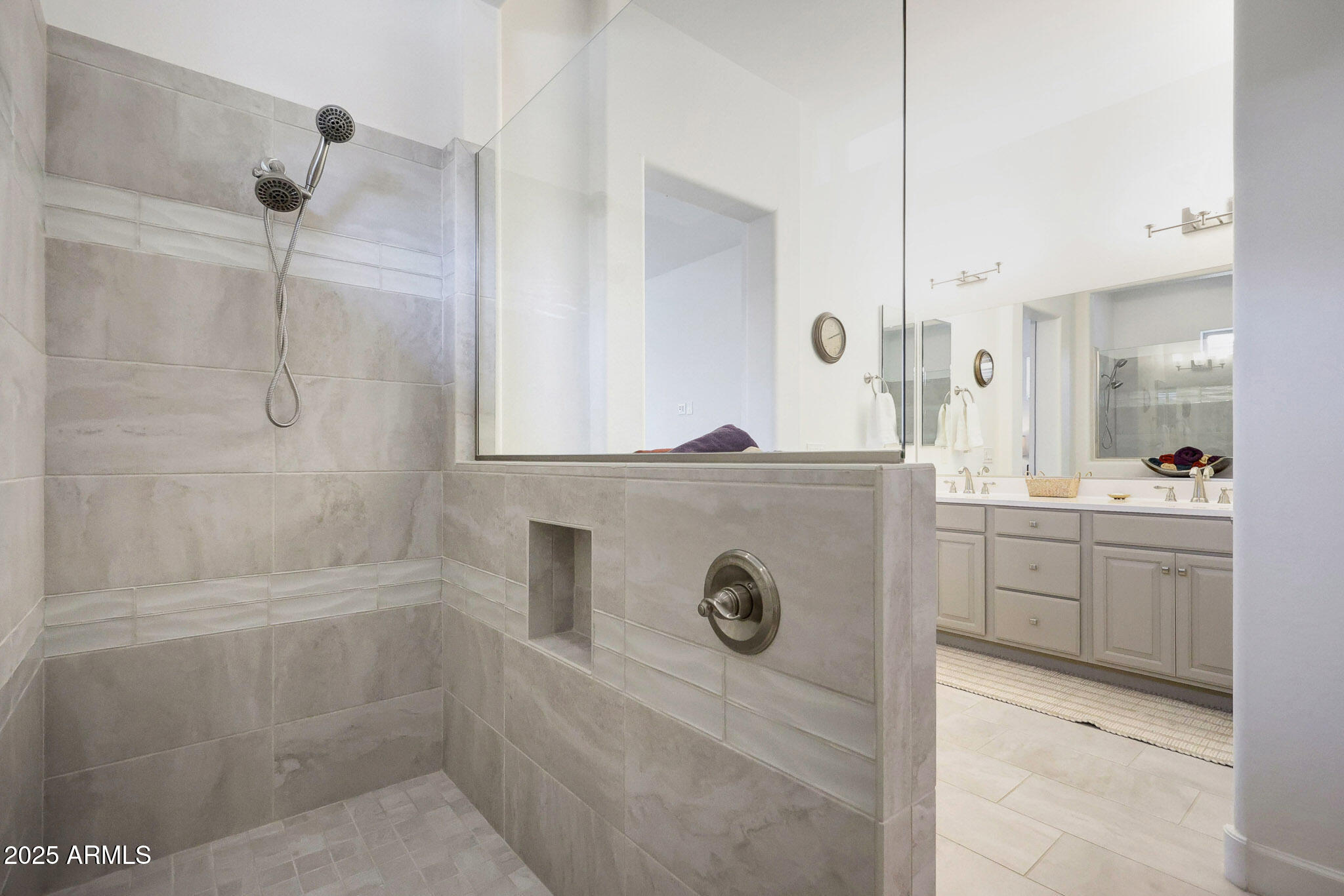 20771 West Colter Street Buckeye, AZ 85396 - Photo 16 of 44 a bathroom with a granite countertop sink a mirror and shower