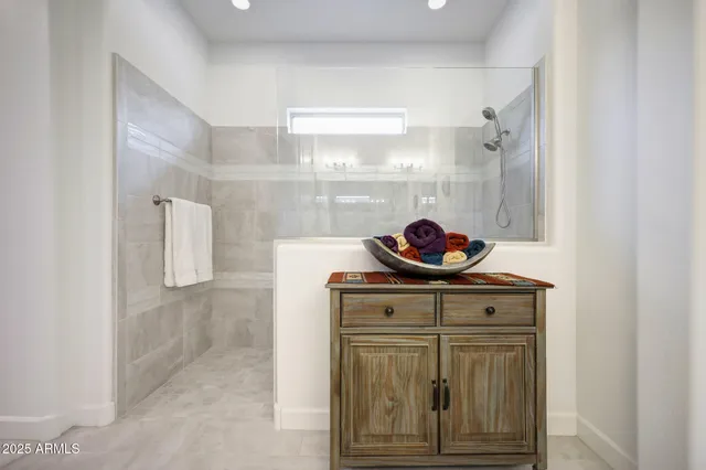 a bathroom with double sink and a mirror