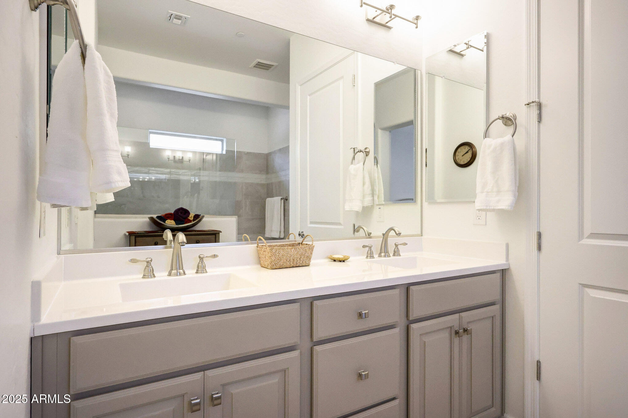 20771 West Colter Street Buckeye, AZ 85396 - Photo 18 of 44 a bathroom with double sink and a mirror