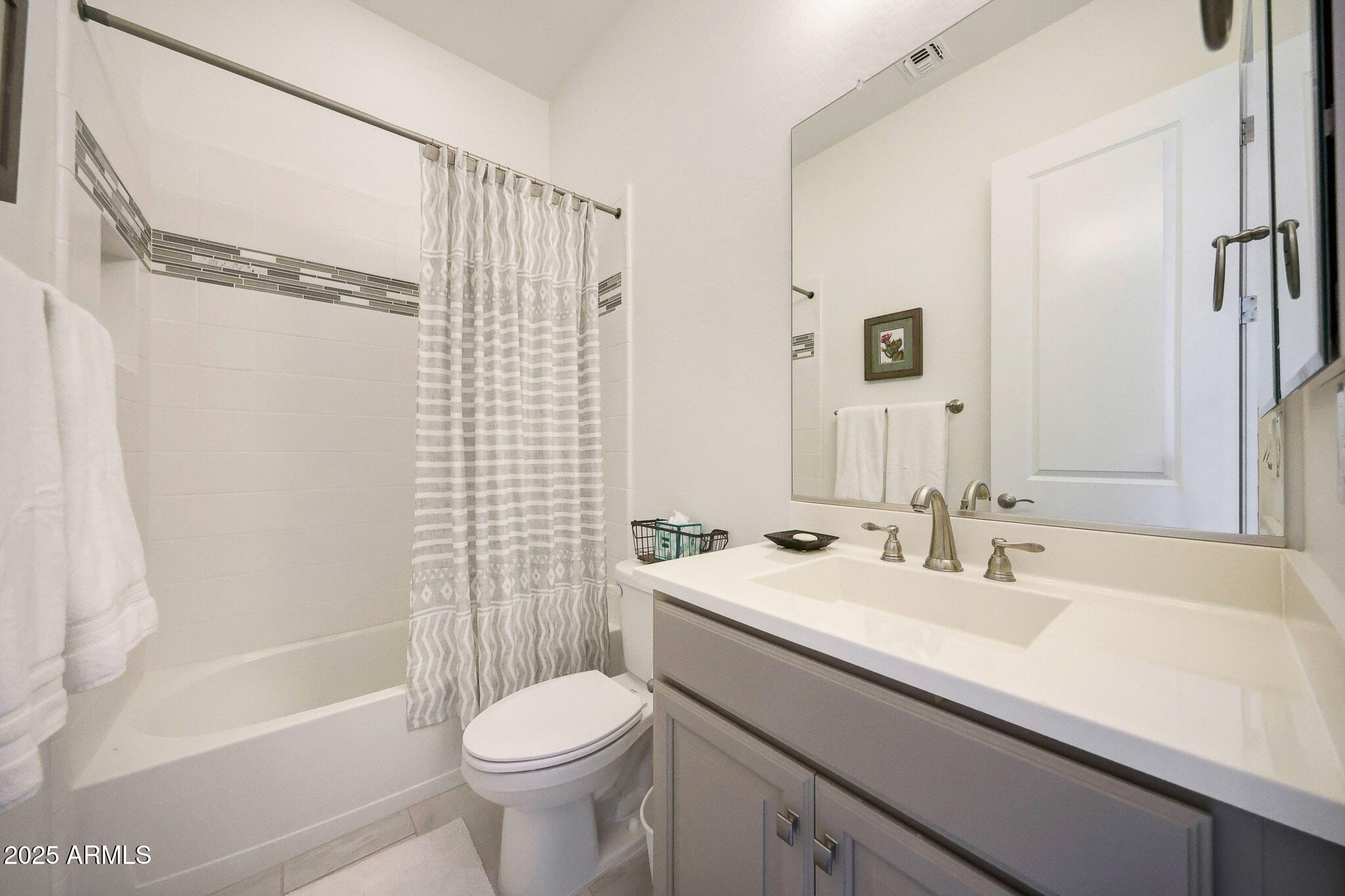 20771 West Colter Street Buckeye, AZ 85396 - Photo 21 of 44 a bathroom with a sink toilet and shower