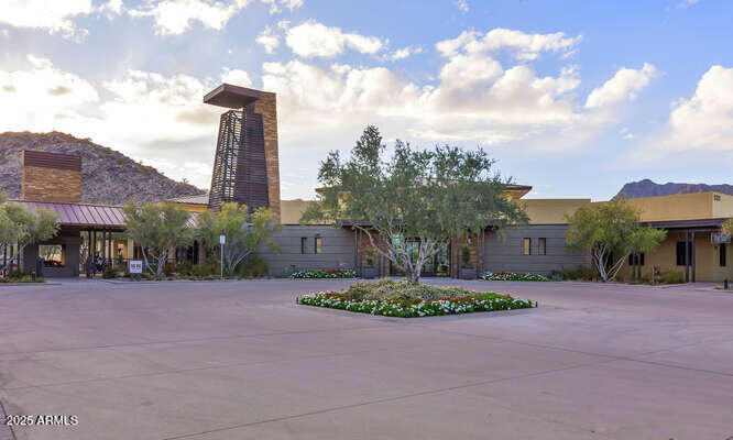 20771 West Colter Street Buckeye, AZ 85396 - Photo 37 of 44 a front view of a house with a garden