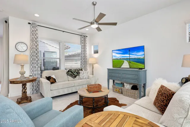 a living room with furniture and a window