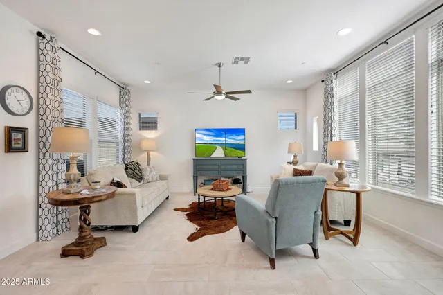a view of a dining room with furniture wooden floor and chandelier