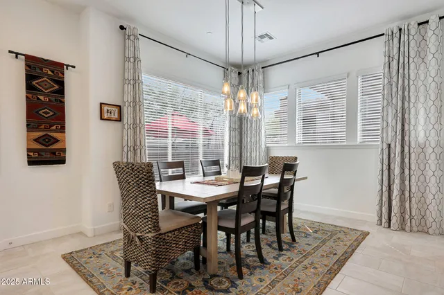 a large kitchen with kitchen island a sink stainless steel appliances and cabinets
