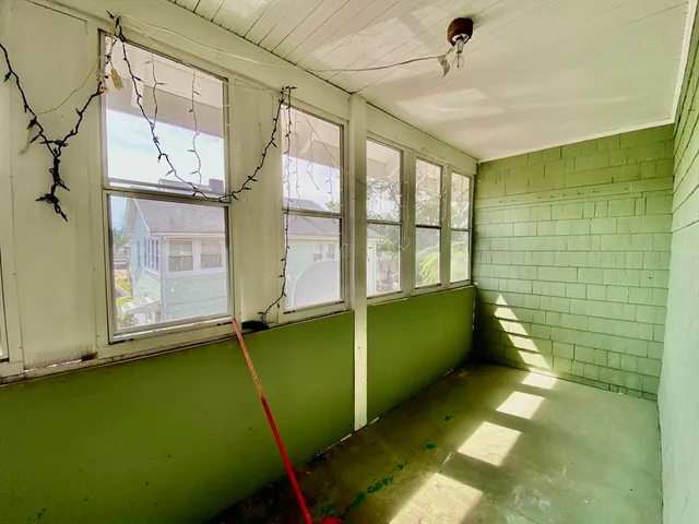 a view of an empty room with a window