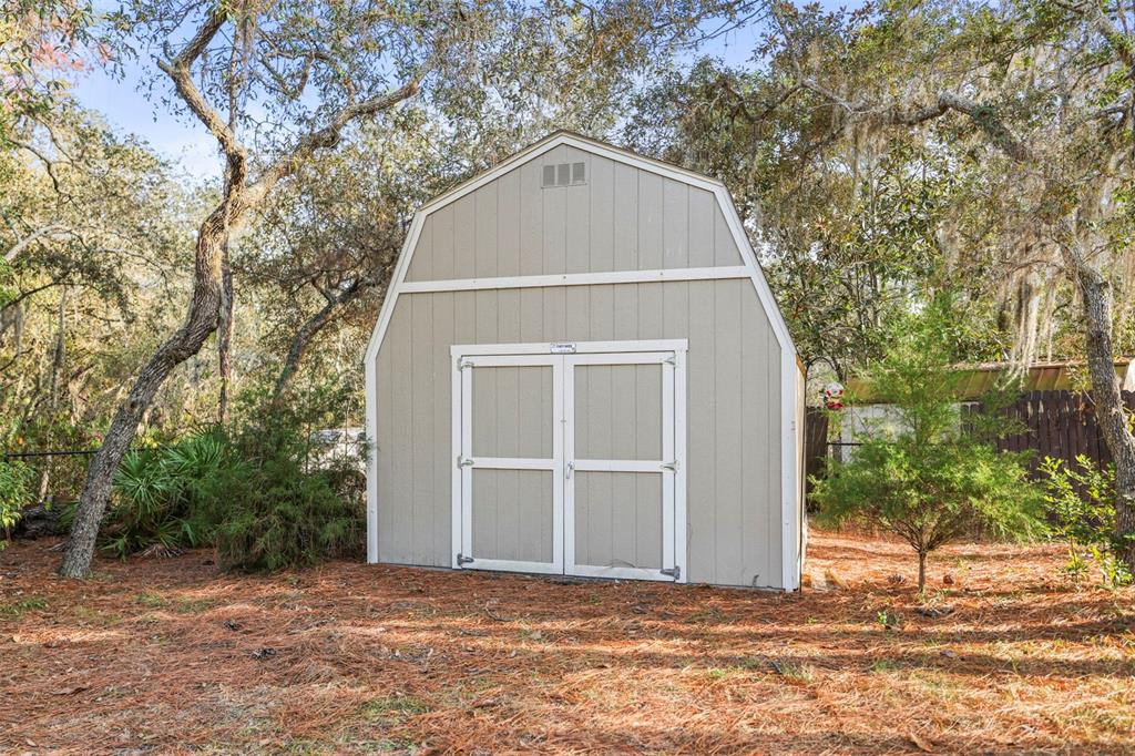 8412 Christopher Lane Weeki Wachee, FL 34613 - Photo 13 of 41 a house with a outdoor space