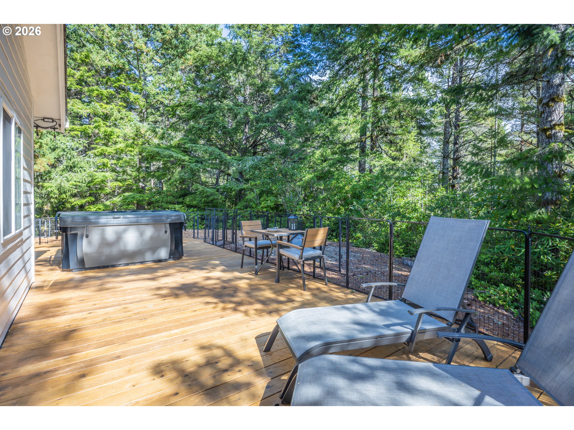 2193 13th Street Florence, OR 97439 - Photo 7 of 48 a view of backyard with swimming pool and patio