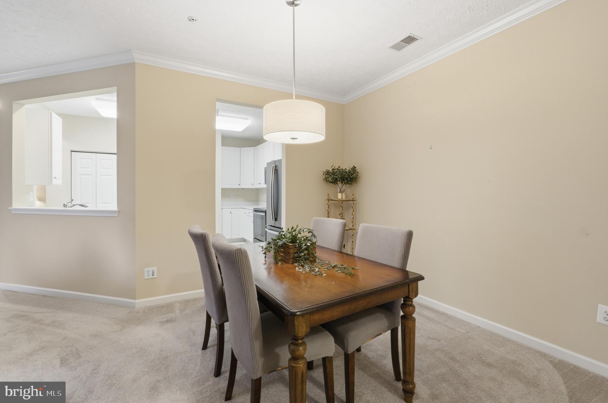 9613 Haven Farm Road, Unit 9613G Perry Hall, MD 21128 - Photo 14 of 37 a view of a dining room with furniture and wooden floor