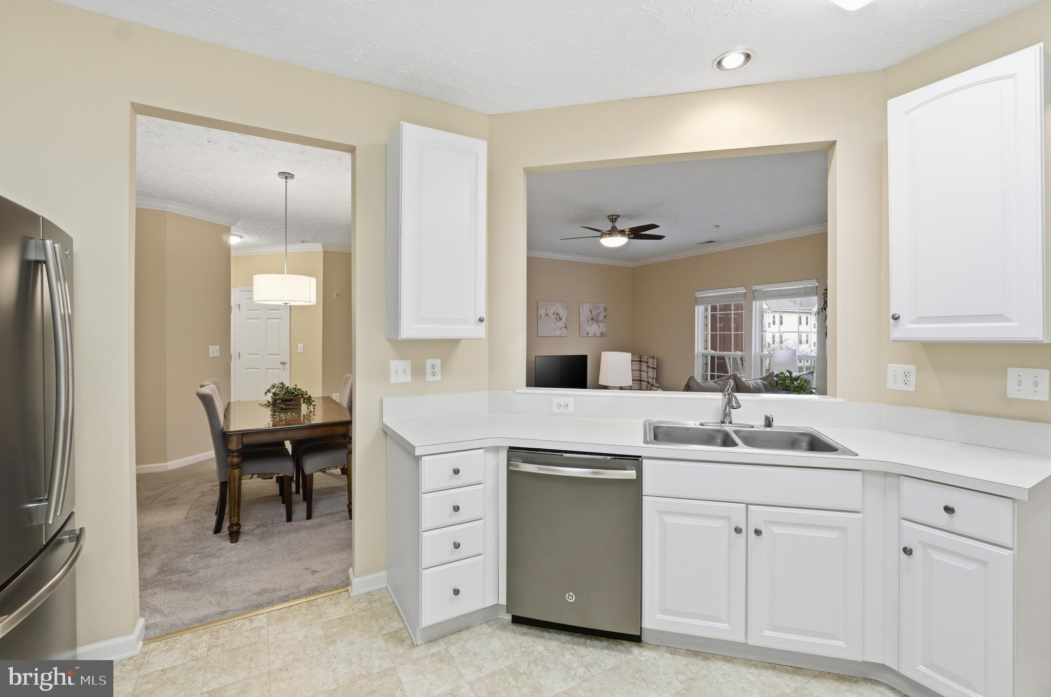 9613 Haven Farm Road, Unit 9613G Perry Hall, MD 21128 - Photo 18 of 37 a spacious bathroom with a double vanity sink a mirror a bathtub and next to a window