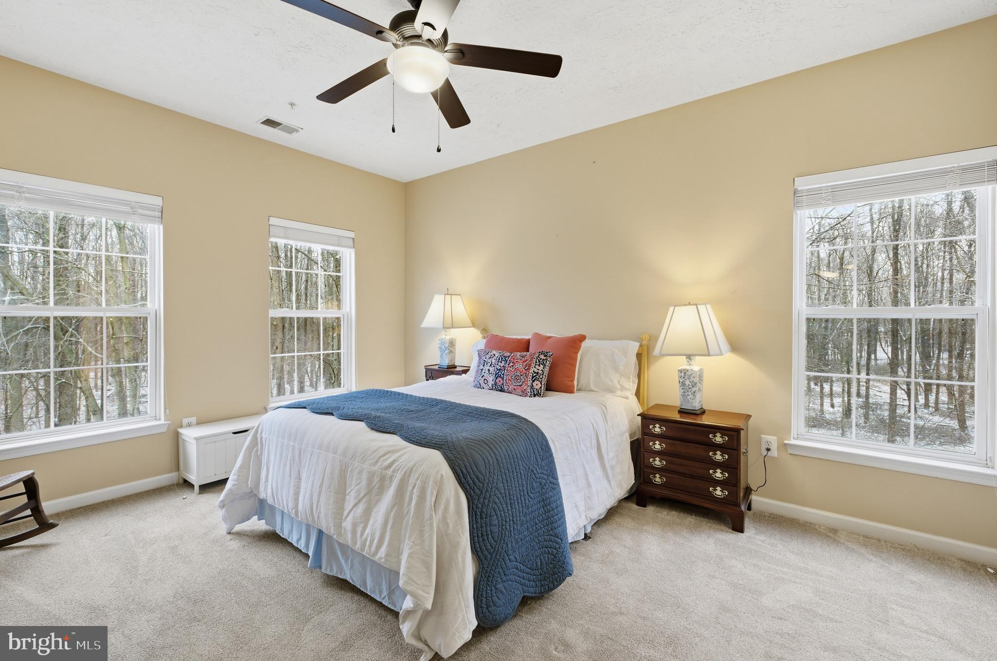 9613 Haven Farm Road, Unit 9613G Perry Hall, MD 21128 - Photo 22 of 37 a spacious bedroom with a bed and a large window