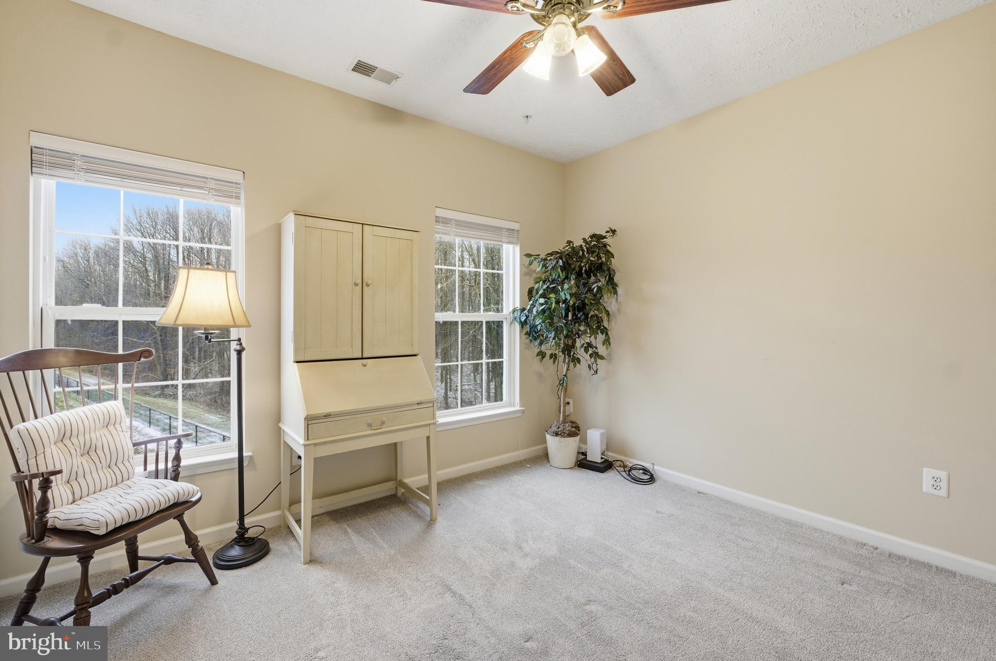 9613 Haven Farm Road, Unit 9613G Perry Hall, MD 21128 - Photo 28 of 37 a view of a livingroom with furniture and a ceiling fan