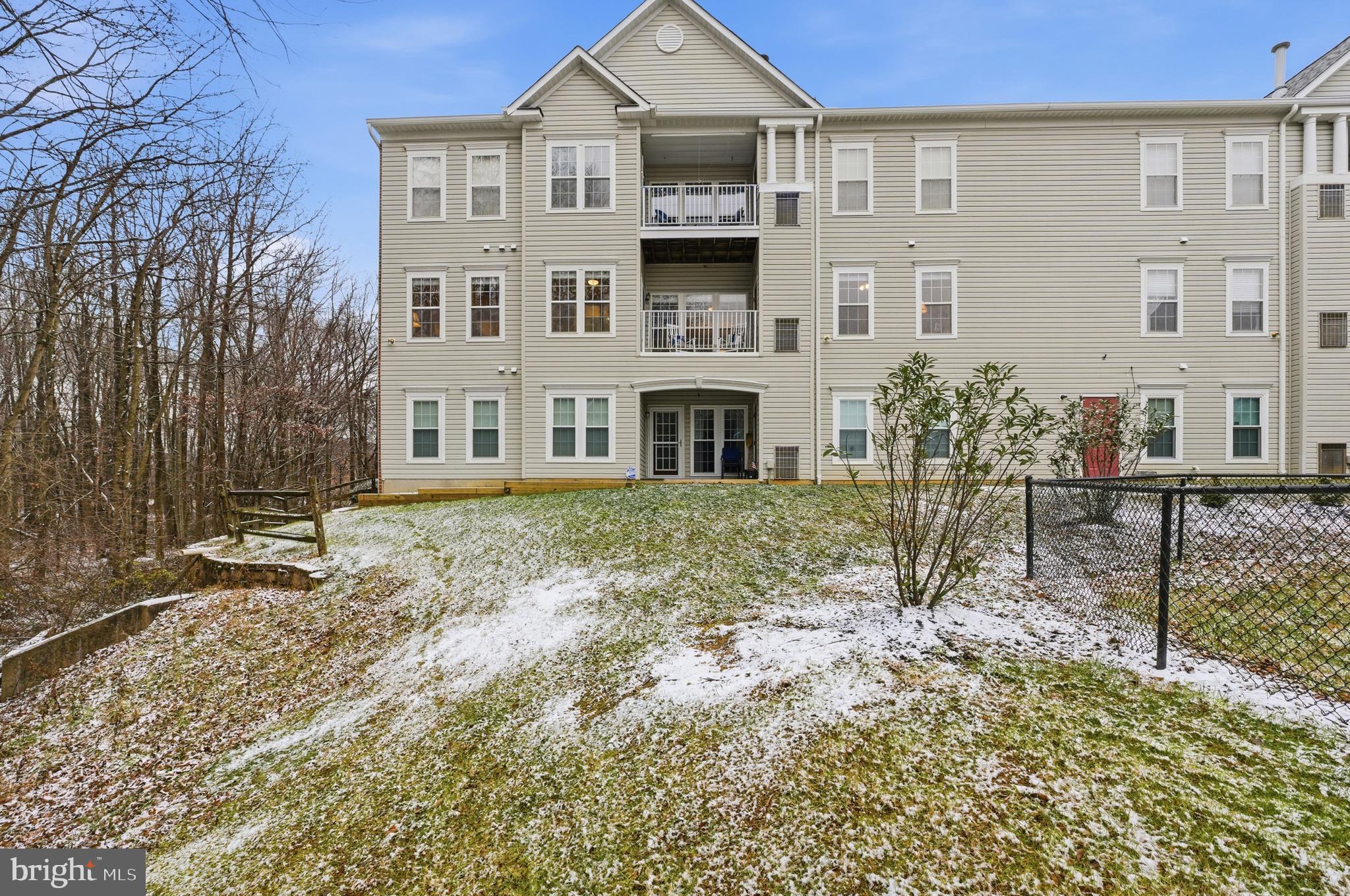 9613 Haven Farm Road, Unit 9613G Perry Hall, MD 21128 - Photo 30 of 37 a front view of a house with garden