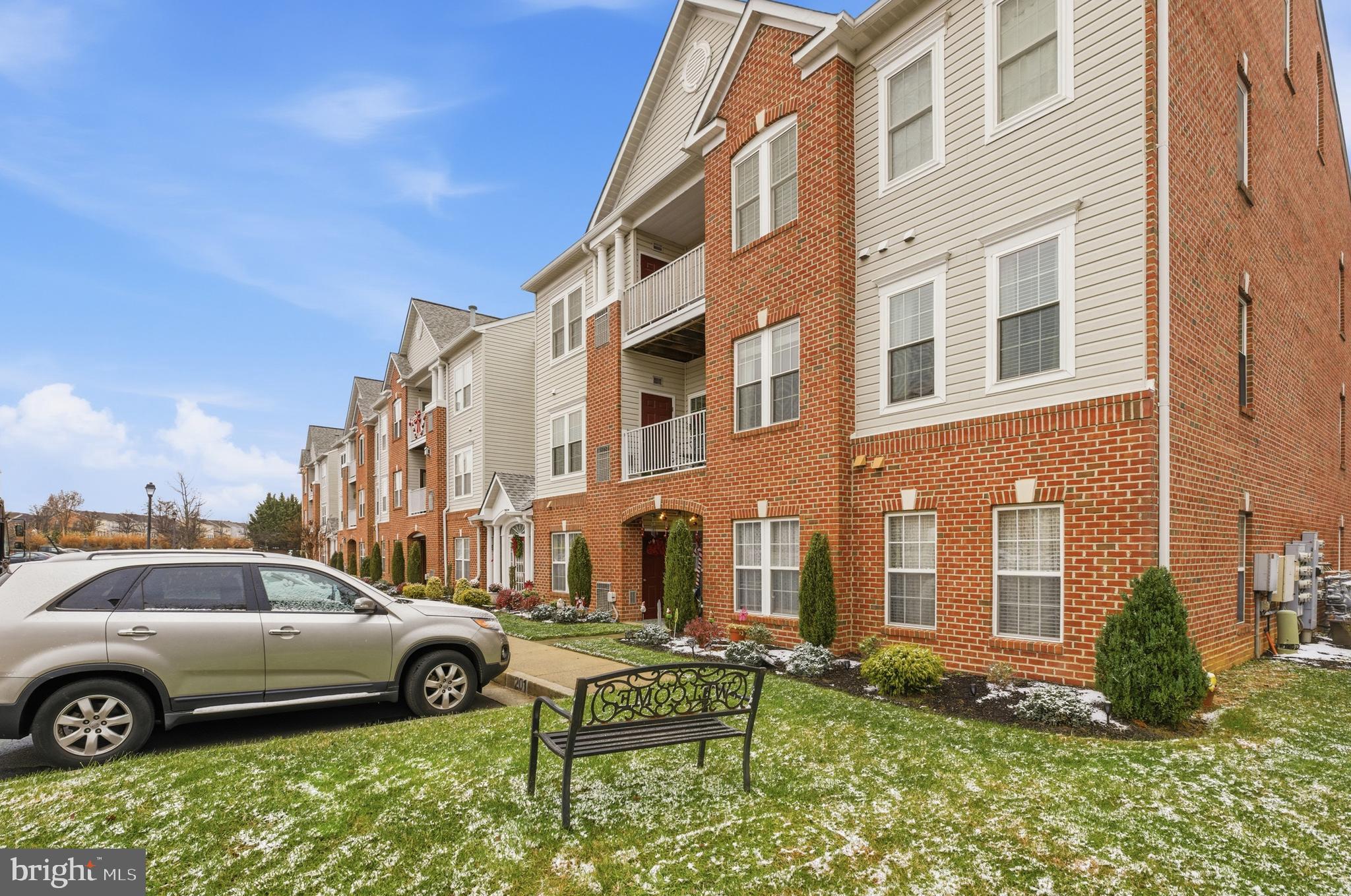 9613 Haven Farm Road, Unit 9613G Perry Hall, MD 21128 - Photo 35 of 37 a front view of a building with parking space