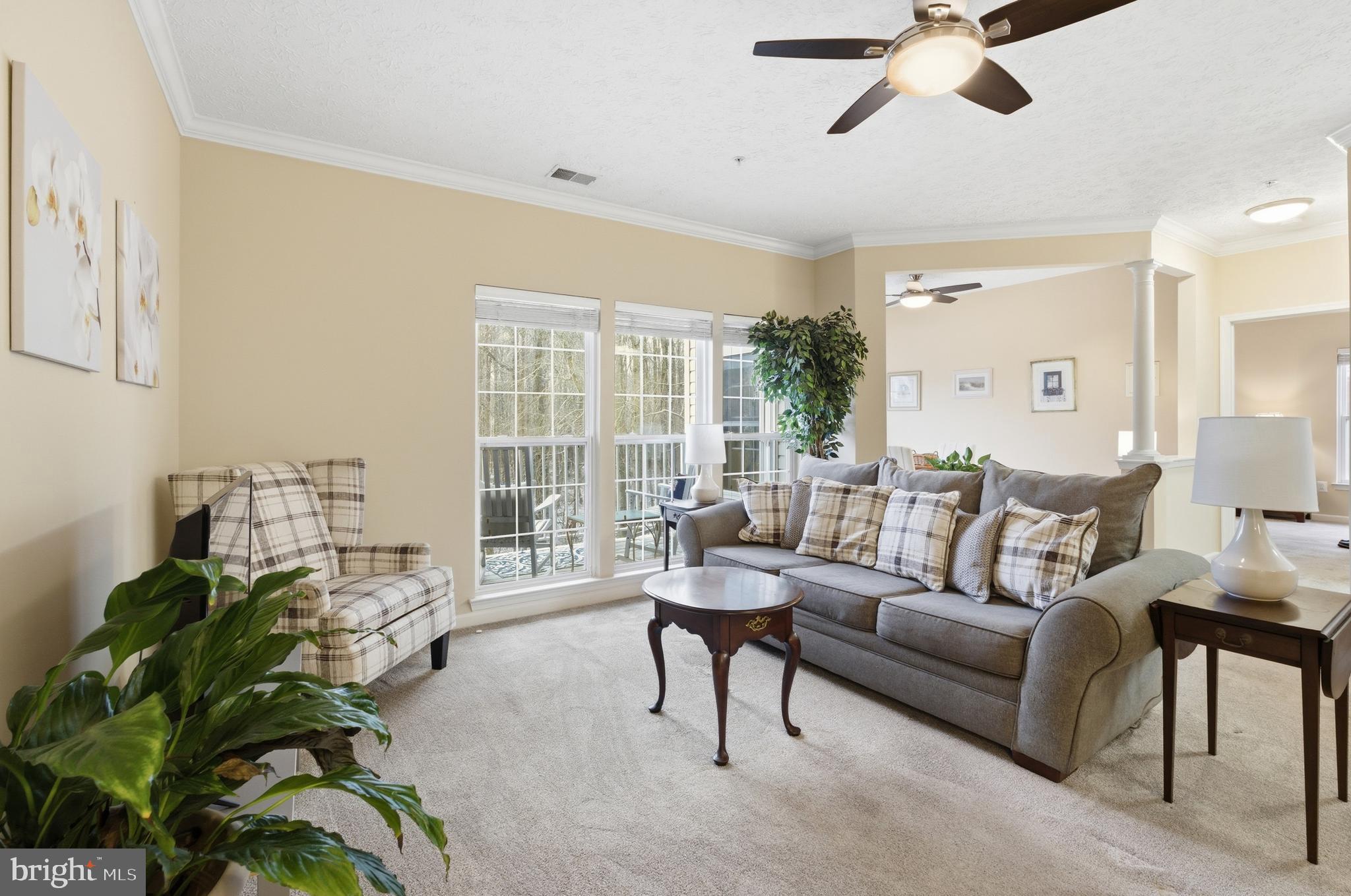 9613 Haven Farm Road, Unit 9613G Perry Hall, MD 21128 - Photo 6 of 37 a living room with furniture and a large window