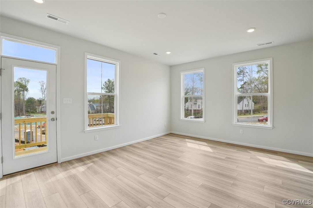 200 That Way Midlothian, VA 23114 - Photo 11 of 35 a view of an empty room with a window and wooden floor