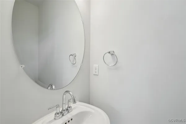 a bathroom with a sink and mirror