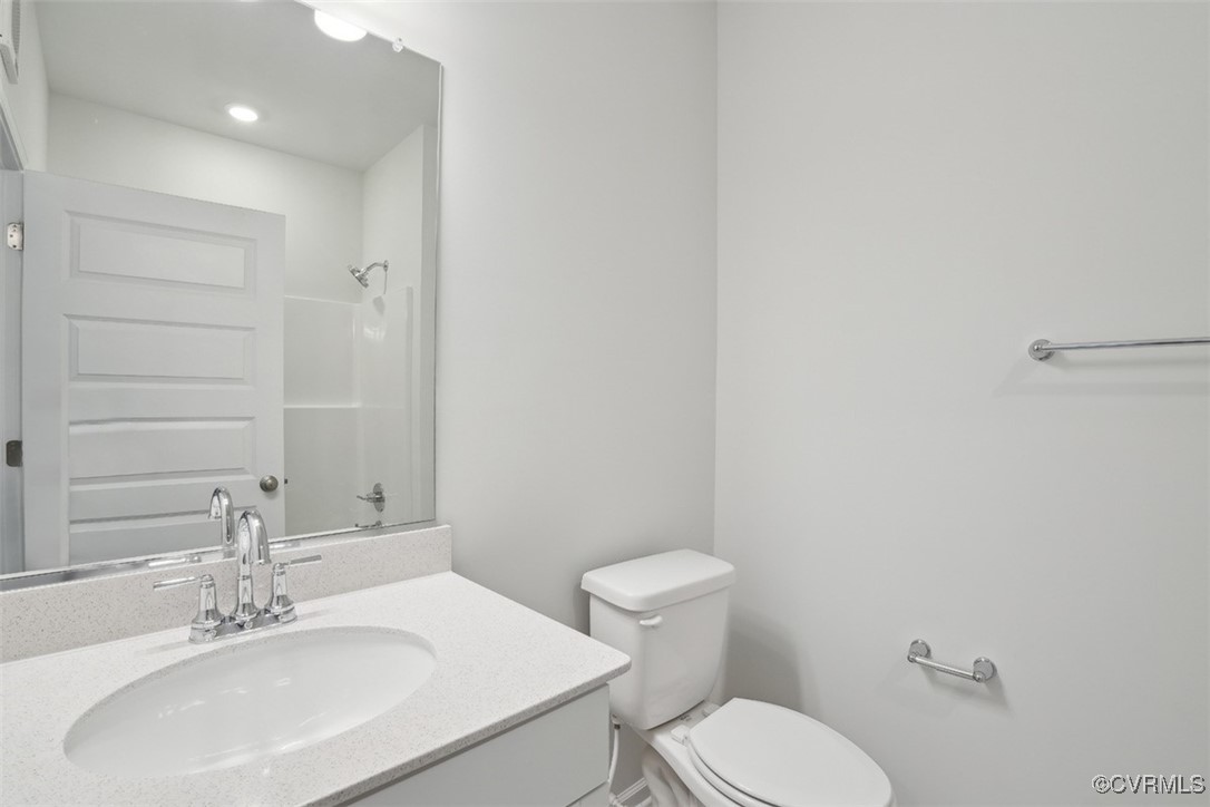 200 That Way Midlothian, VA 23114 - Photo 29 of 35 a bathroom with a sink a toilet and mirror