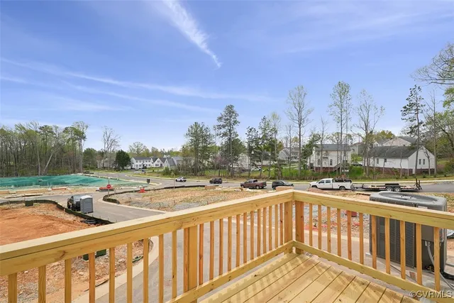 a view of a balcony with trees