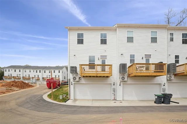 a view of a balcony and yard