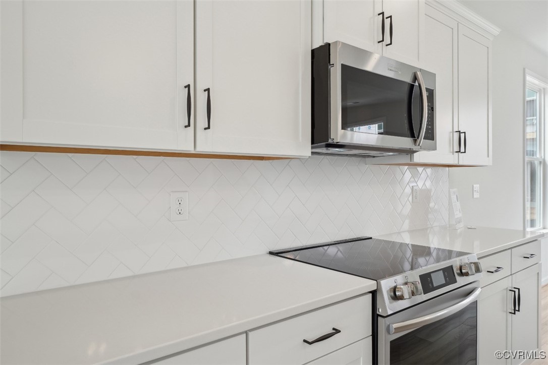 200 That Way Midlothian, VA 23114 - Photo 6 of 35 a kitchen with a stove and a microwave
