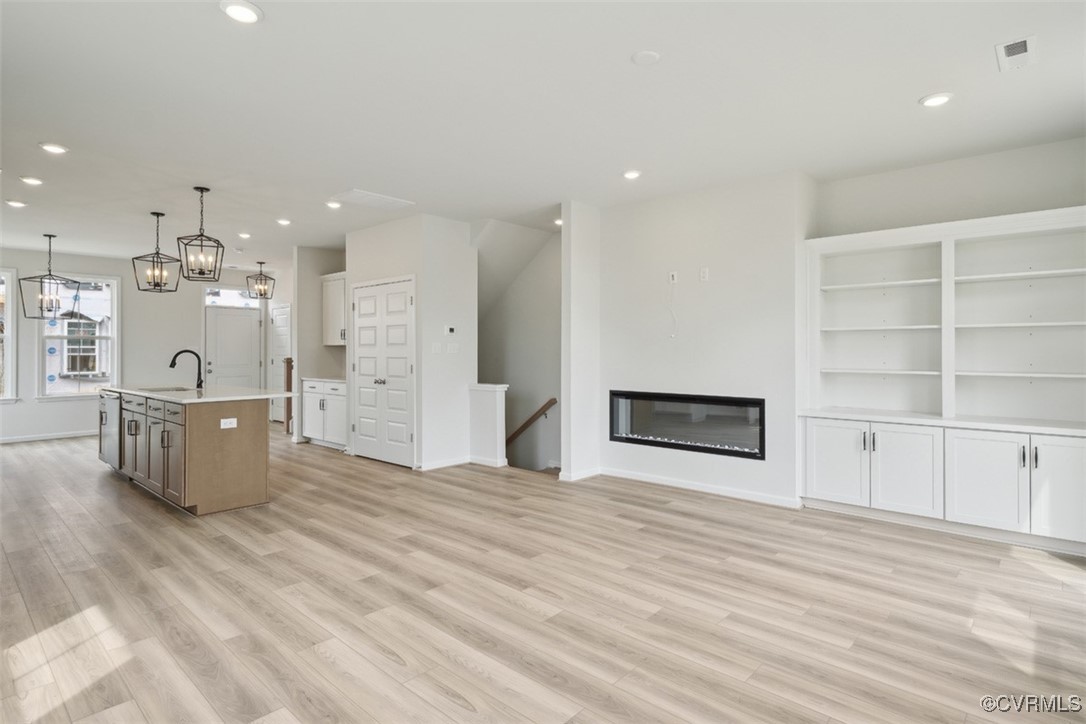 200 That Way Midlothian, VA 23114 - Photo 10 of 35 a large white kitchen with wooden floor and a sink