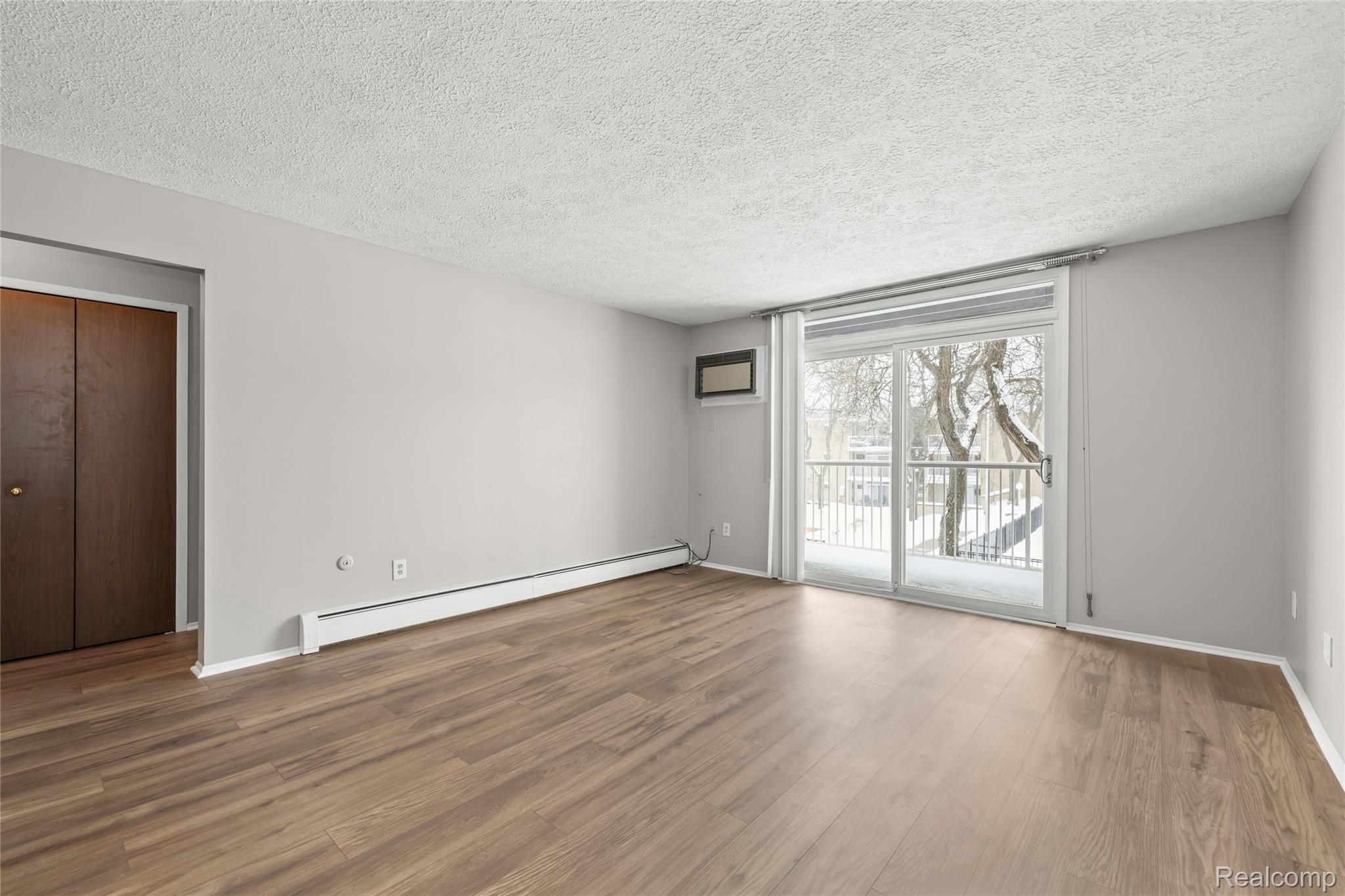 4909 Crooks Road, Unit D6 Royal Oak, MI 48073 - Photo 9 of 16 Living Room with door wall to private balcony