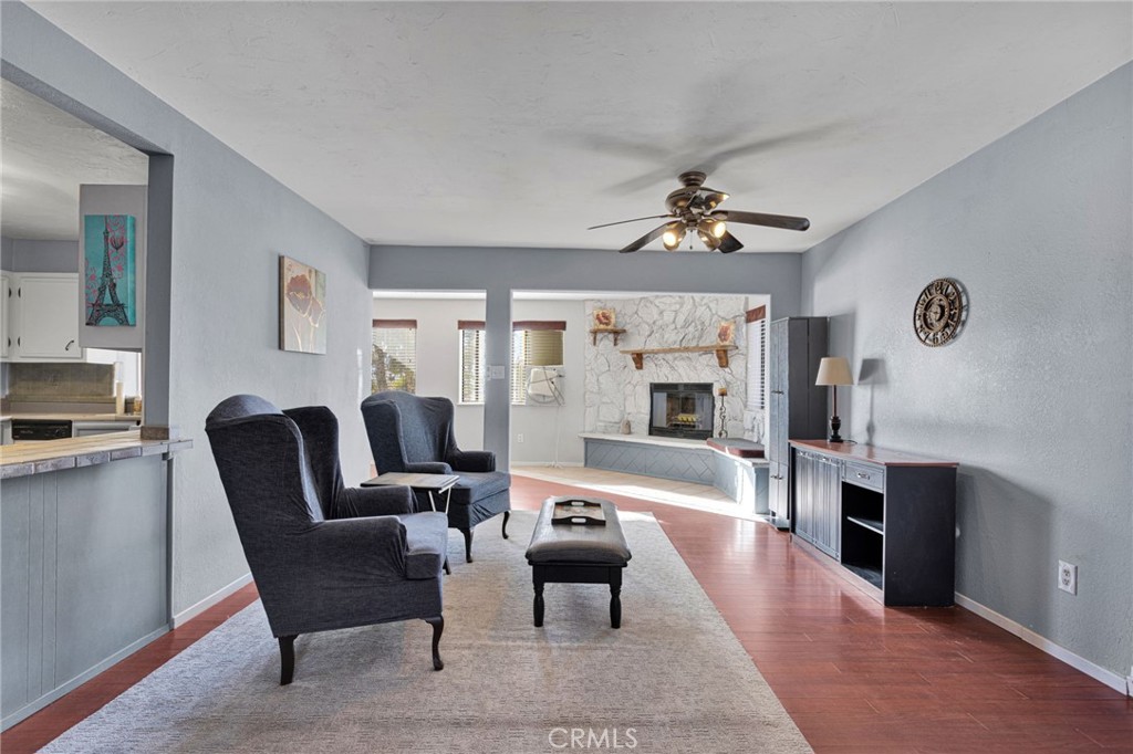 38744 East End Road Lucerne Valley, CA 92356 - Photo 16 of 46 a living room with furniture fireplace and a table