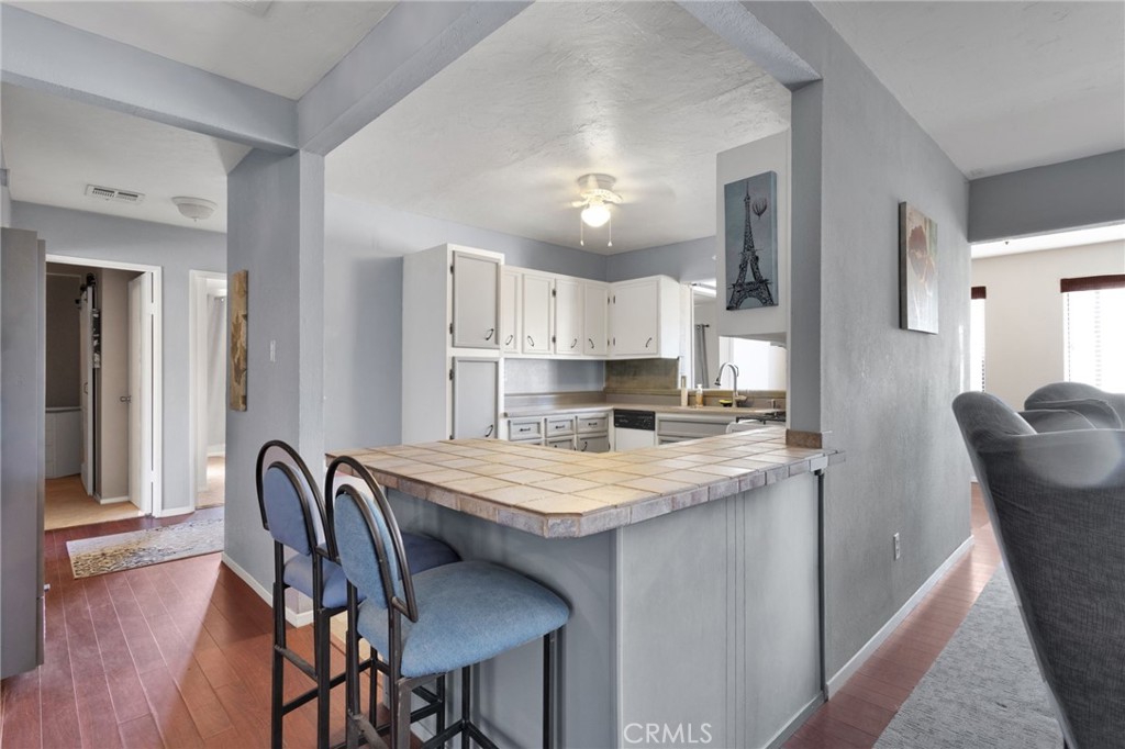 38744 East End Road Lucerne Valley, CA 92356 - Photo 18 of 46 a view of kitchen with cabinets and wooden floor