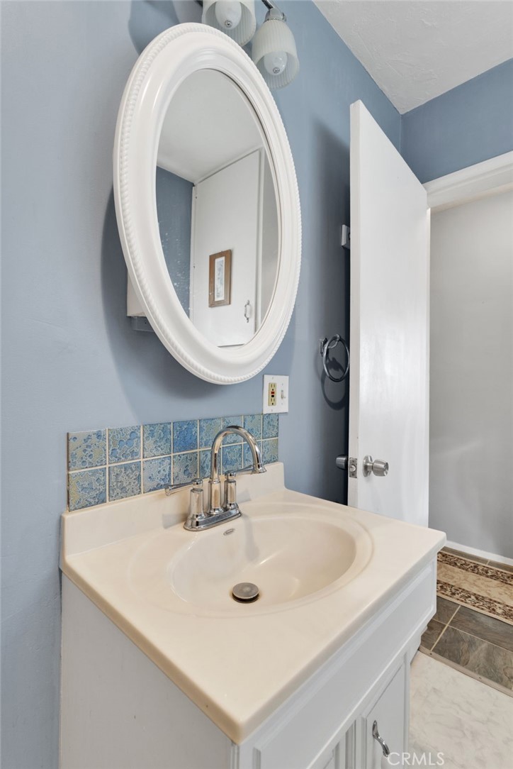 38744 East End Road Lucerne Valley, CA 92356 - Photo 26 of 46 a bathroom with a sink and a mirror