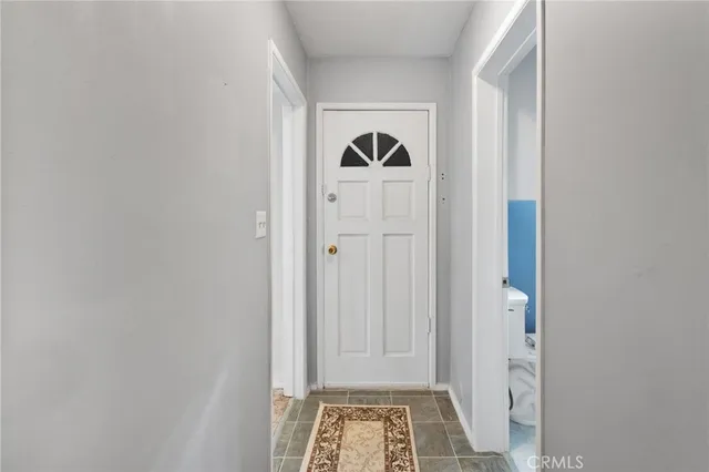 a view of room with cabinet and air conditioner