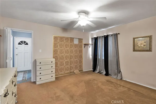 an empty room with a dresser