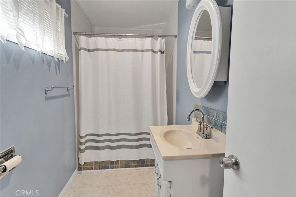 38744 East End Road Lucerne Valley, CA 92356 - Photo 30 of 46 a bathroom with a sink and a mirror