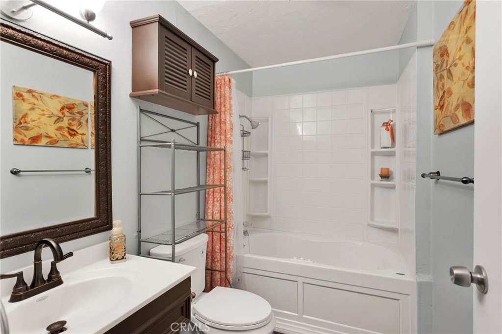 38744 East End Road Lucerne Valley, CA 92356 - Photo 31 of 46 a bathroom with a sink toilet and shower