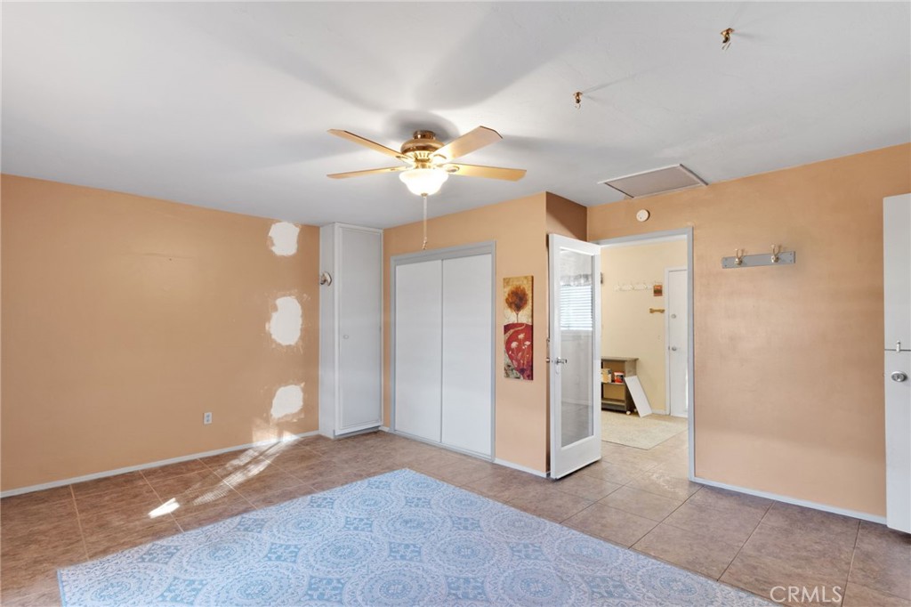 38744 East End Road Lucerne Valley, CA 92356 - Photo 34 of 46 wooden floor in an empty room with a window
