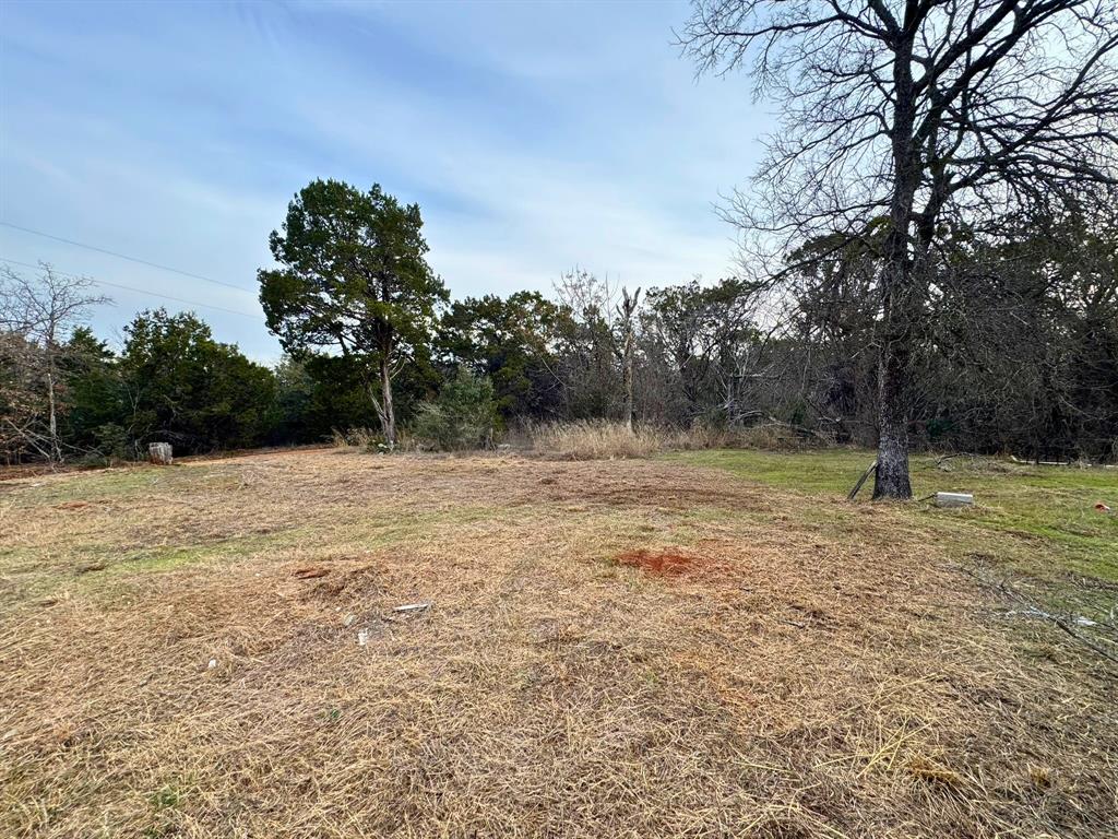 349 South Possum Creek Road Waco, TX 76708 - Photo 2 of 6 a backyard of a house with lots of green space