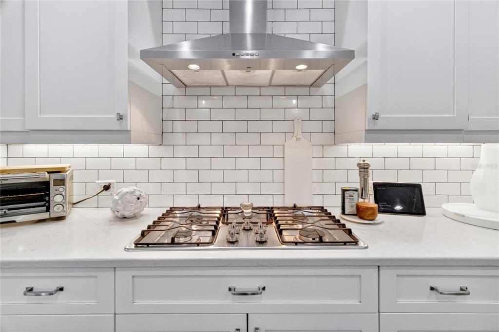 3363 Southwest 115th Terrace Gainesville, FL 32608 - Photo 11 of 43 a kitchen with a stove and cabinets