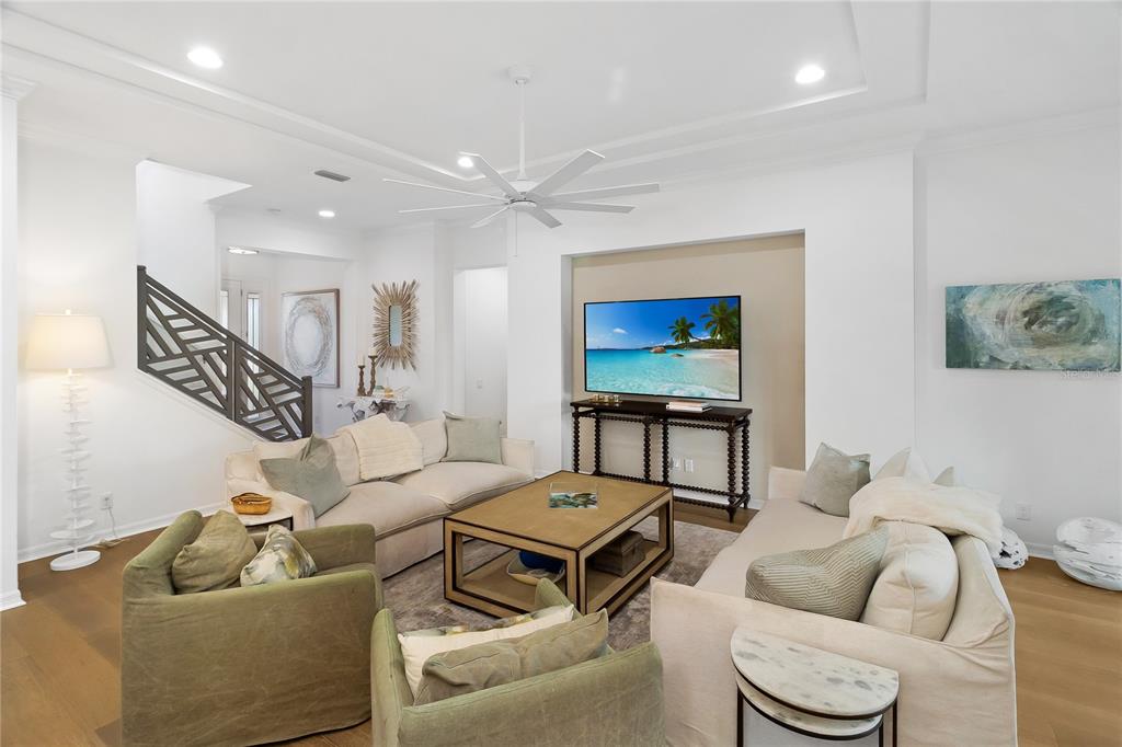 3363 Southwest 115th Terrace Gainesville, FL 32608 - Photo 12 of 43 a living room with furniture and a wooden floor