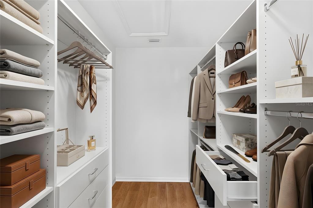 3363 Southwest 115th Terrace Gainesville, FL 32608 - Photo 17 of 43 a view of walk in closet with clothes and shoes
