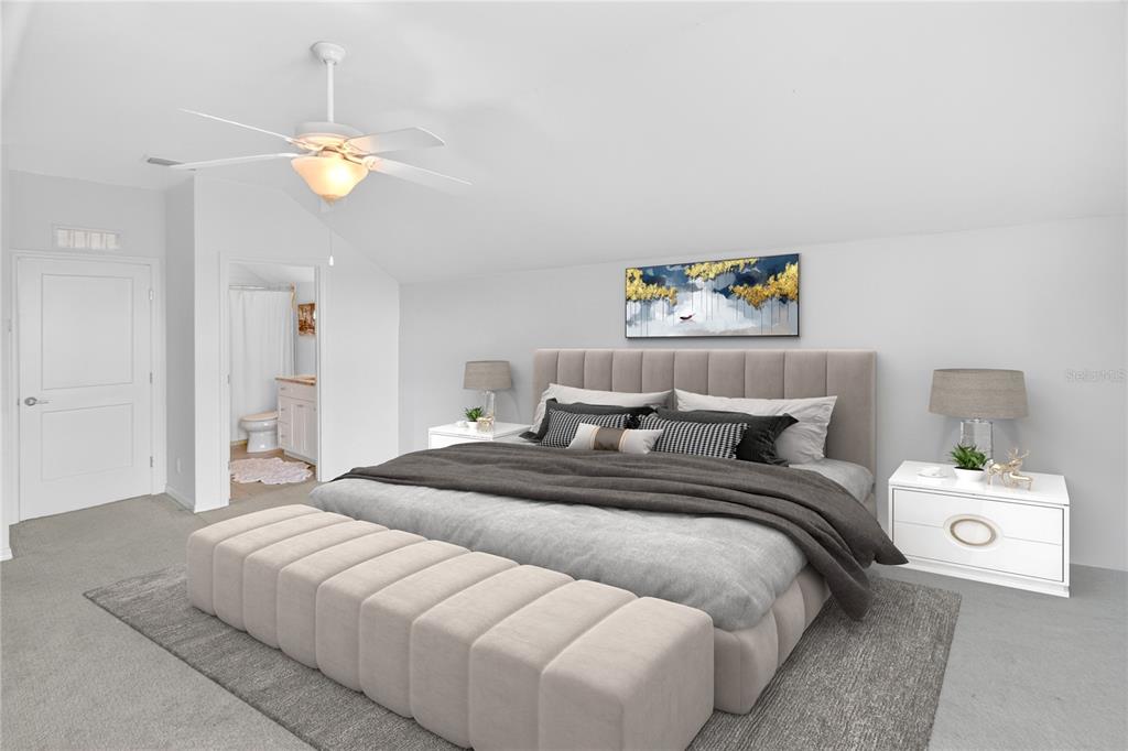 3363 Southwest 115th Terrace Gainesville, FL 32608 - Photo 21 of 43 a bedroom with a bed and a chandelier