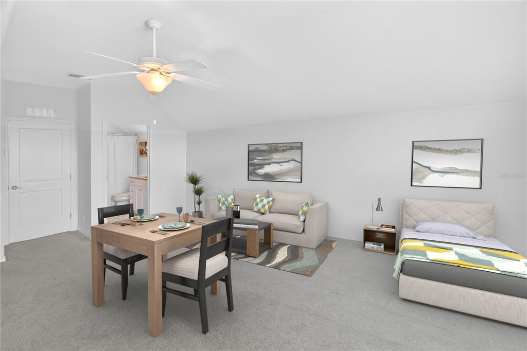 3363 Southwest 115th Terrace Gainesville, FL 32608 - Photo 23 of 43 a dining room with furniture and a chandelier