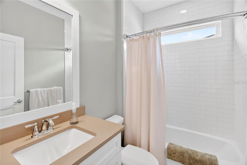 3363 Southwest 115th Terrace Gainesville, FL 32608 - Photo 26 of 43 a bathroom with a sink toilet and shower