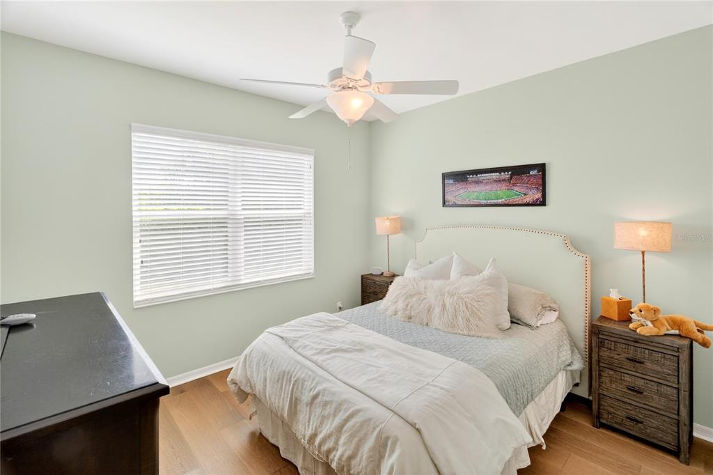 3363 Southwest 115th Terrace Gainesville, FL 32608 - Photo 27 of 43 a bedroom with a bed and a window