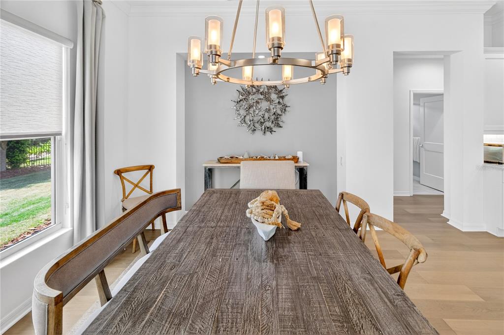 3363 Southwest 115th Terrace Gainesville, FL 32608 - Photo 29 of 43 a bedroom with a bed and wooden floor