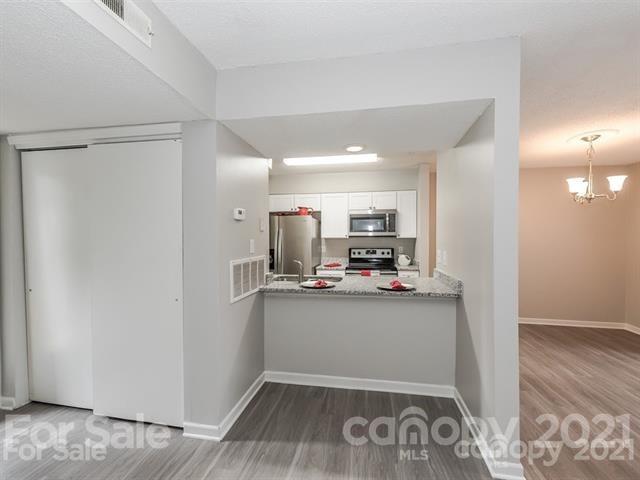 10961 Harrowfield Road Charlotte, NC 28226 - Photo 4 of 13 a view of kitchen and utility room