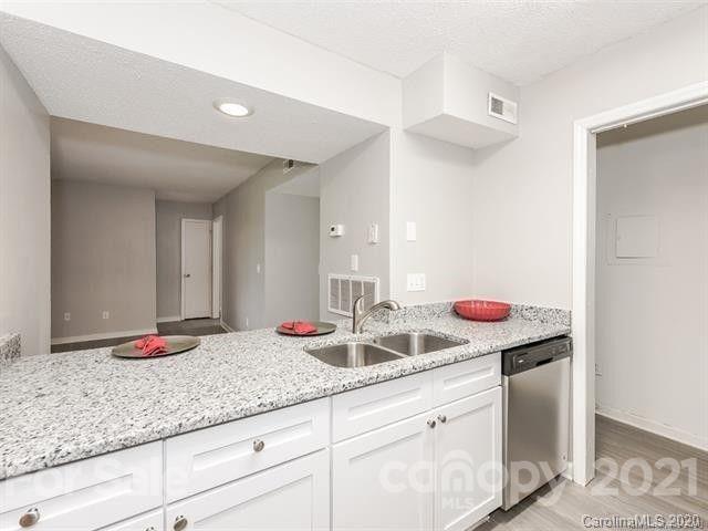 10961 Harrowfield Road Charlotte, NC 28226 - Photo 5 of 13 a bathroom with a granite countertop sink and a mirror