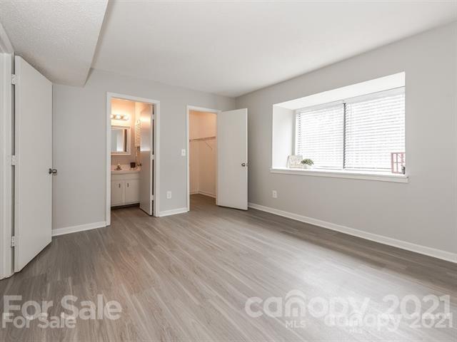 10961 Harrowfield Road Charlotte, NC 28226 - Photo 8 of 13 an empty room with windows